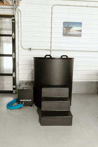 Round black ice bath tub with lid, chiller unit and step platform, front view
