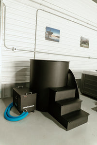 Ice bath tub with the lid off, shown alongside a hot tub